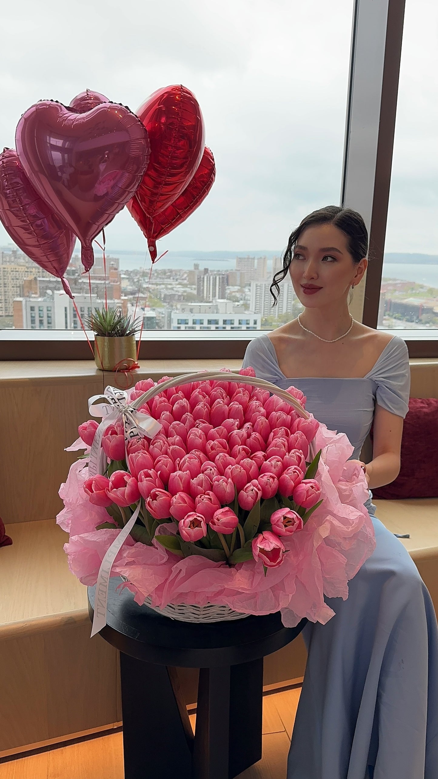 100 PINK TULIPS IN A BASKET