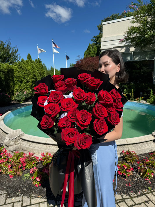 25 RED ROSES/ BLACK WRAPPING