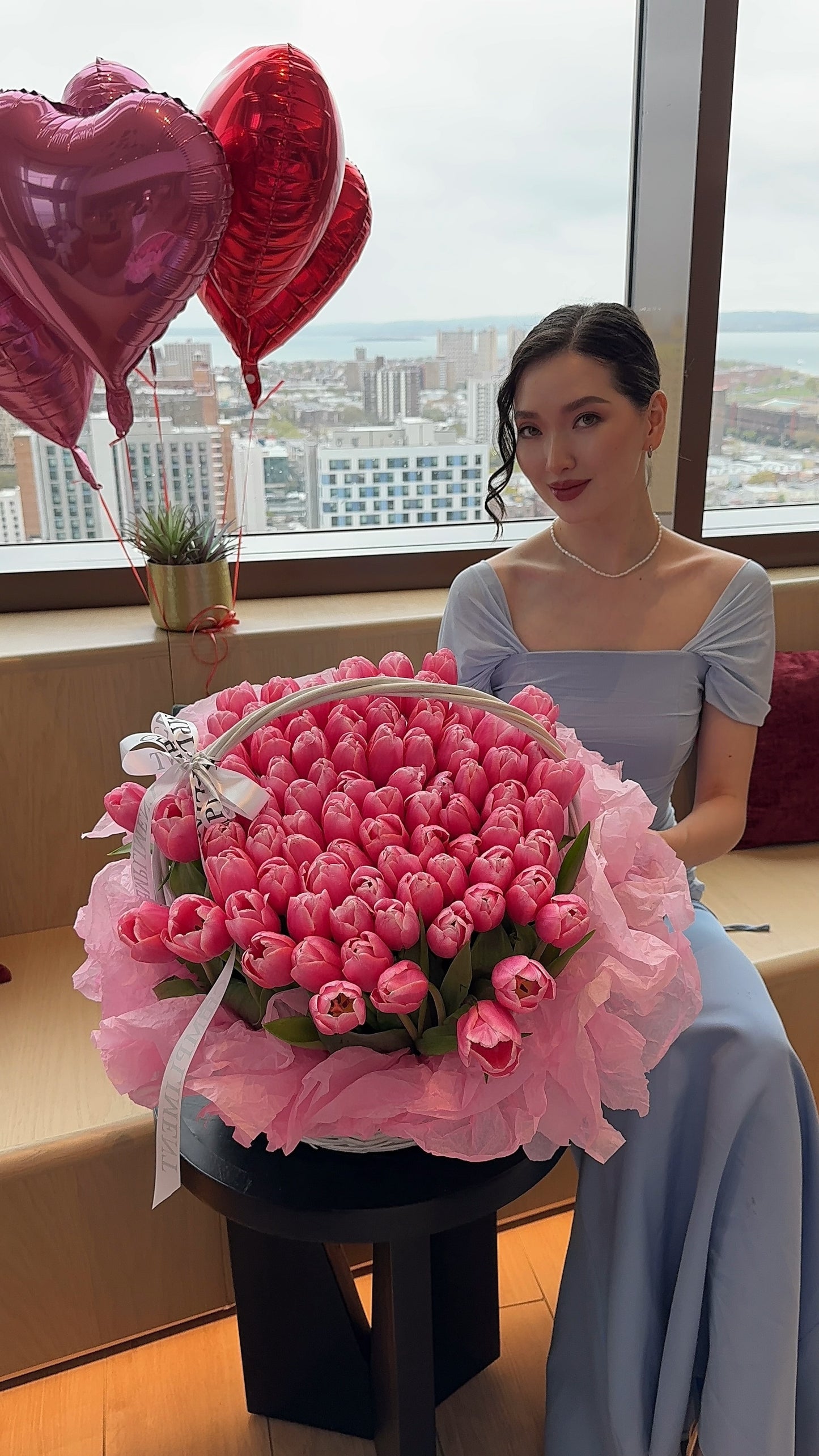 100 PINK TULIPS IN A BASKET