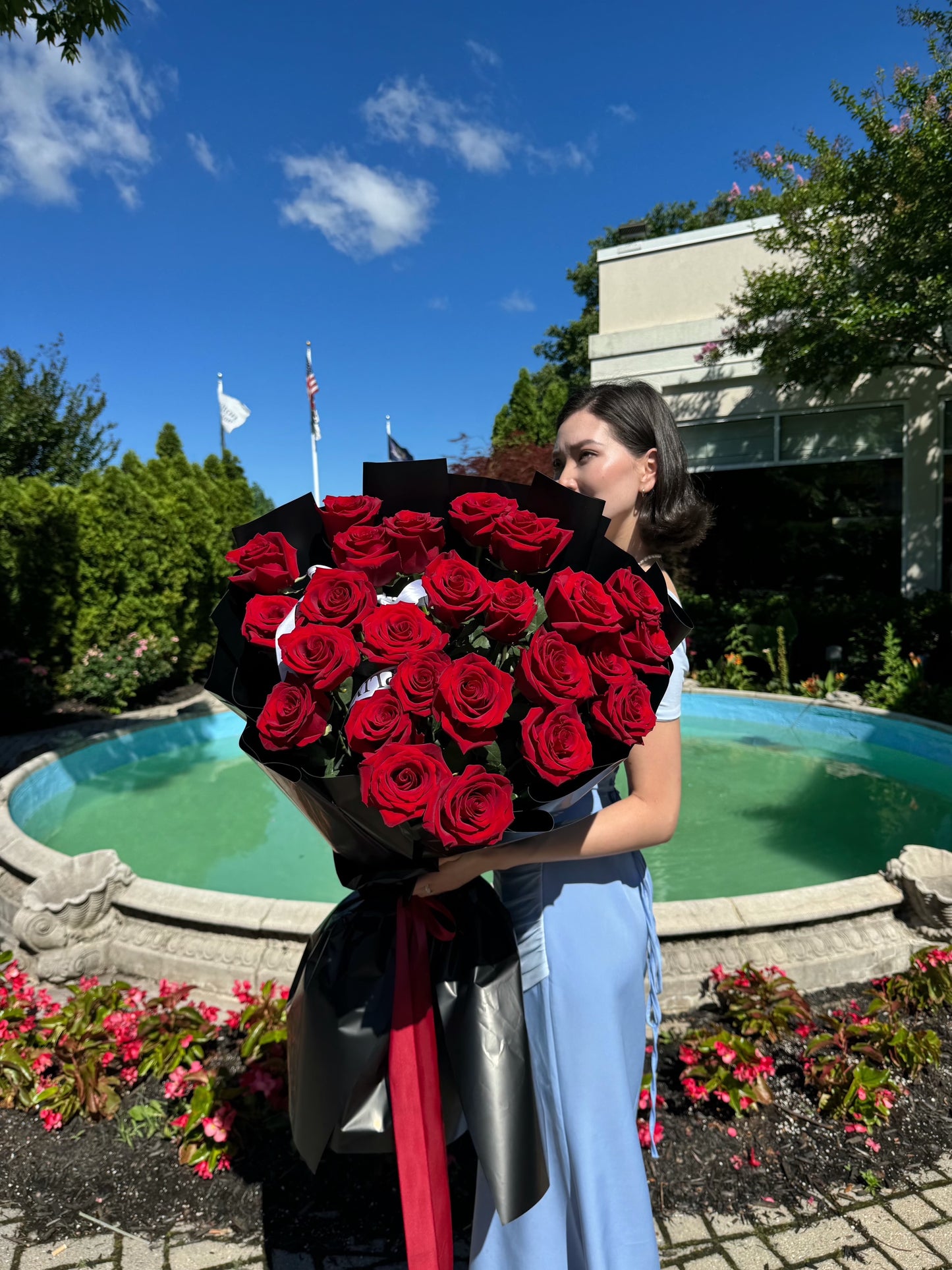 25 RED ROSES/ BLACK WRAPPING