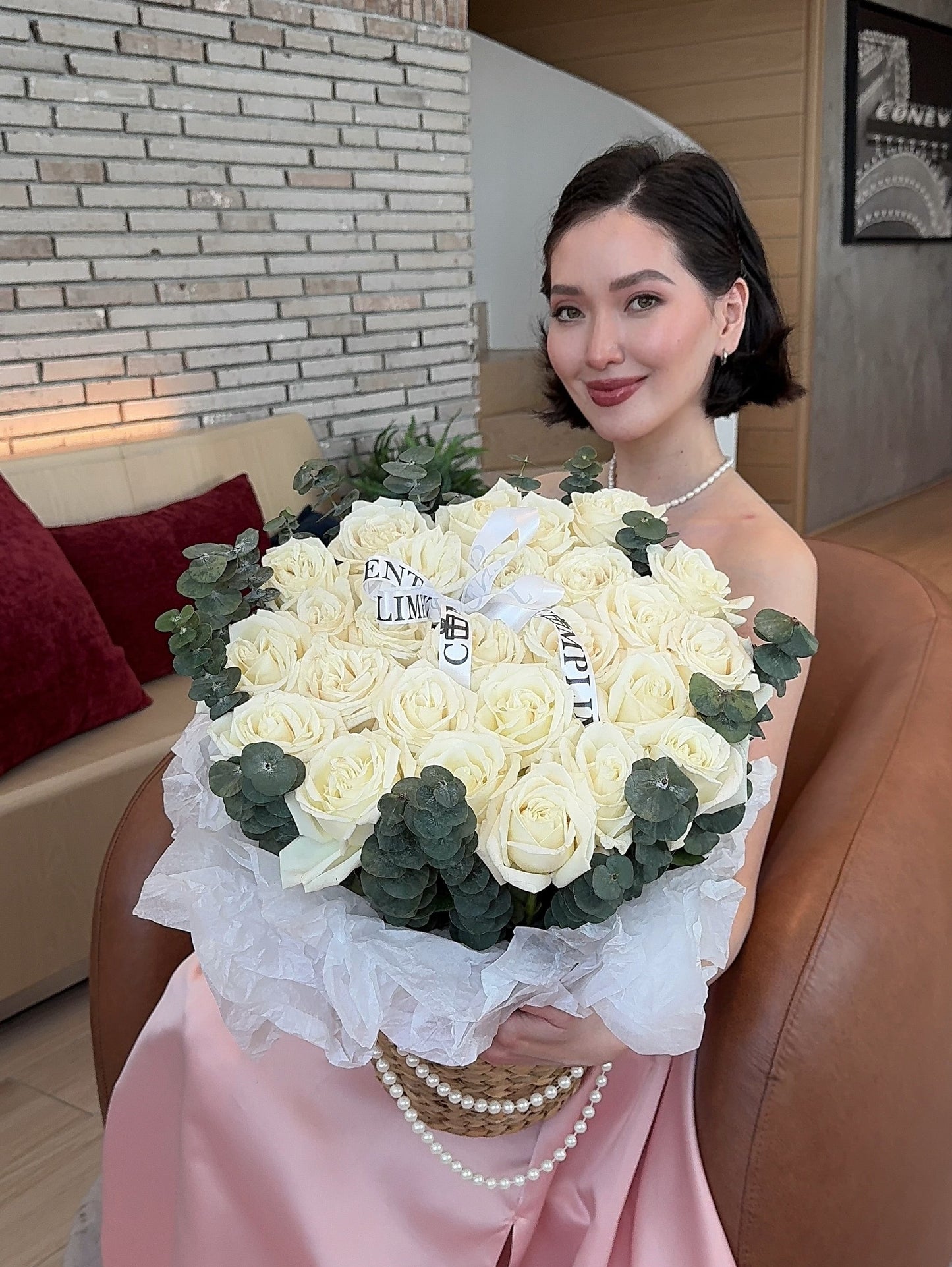 25 WHITE ROSES IN A BASKET