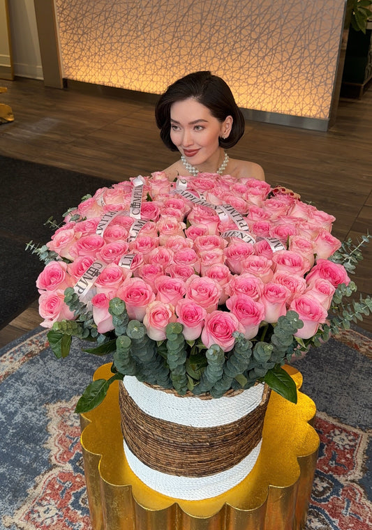 100 PINK ROSES IN A BASKET