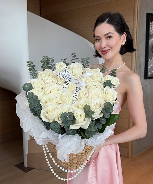 25 WHITE ROSES IN A BASKET